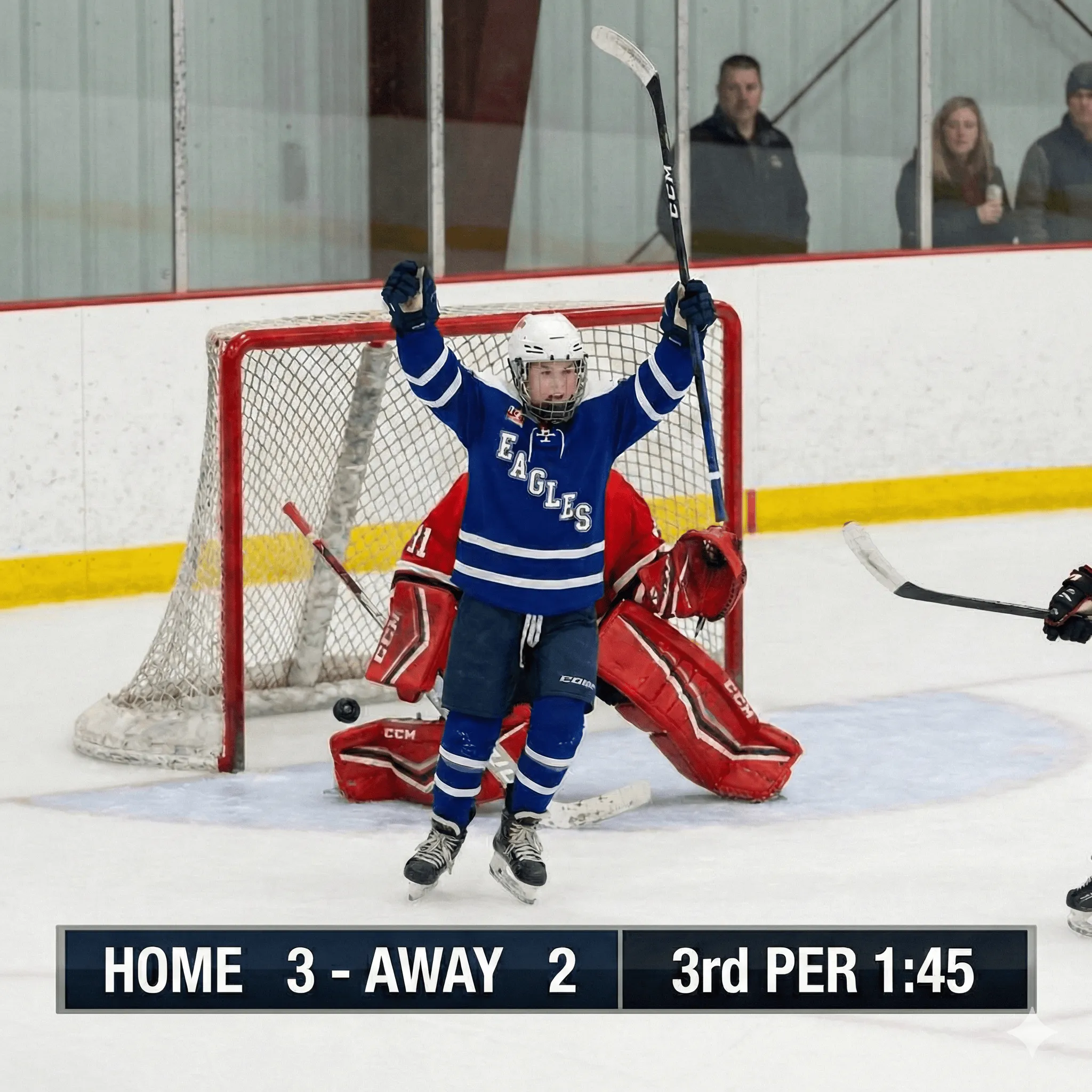 Youth hockey player celebrating a goal on the ice